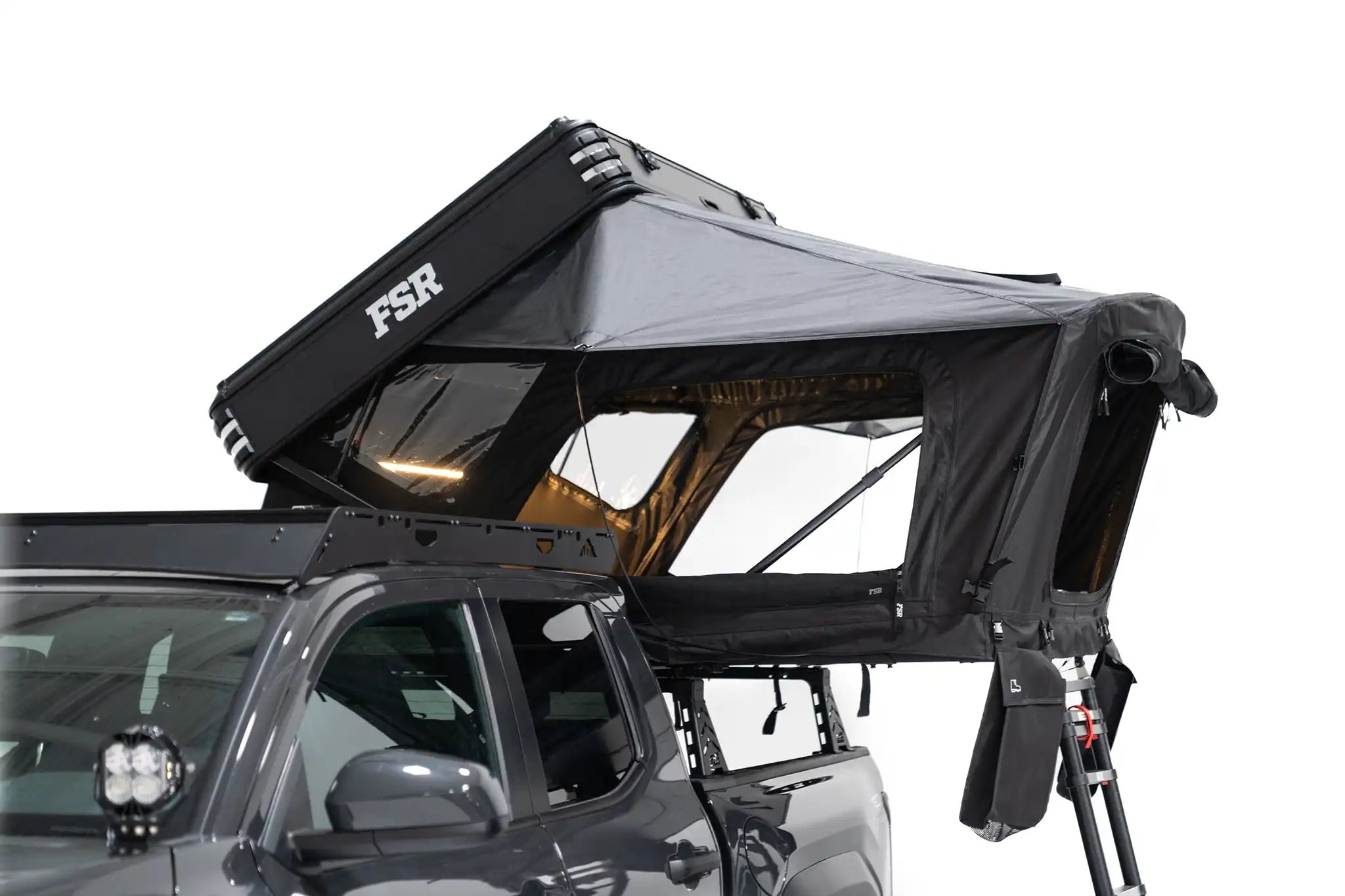 Free Spirit Recreation Kali aluminum hard-shell rooftop tent set up on a vehicle