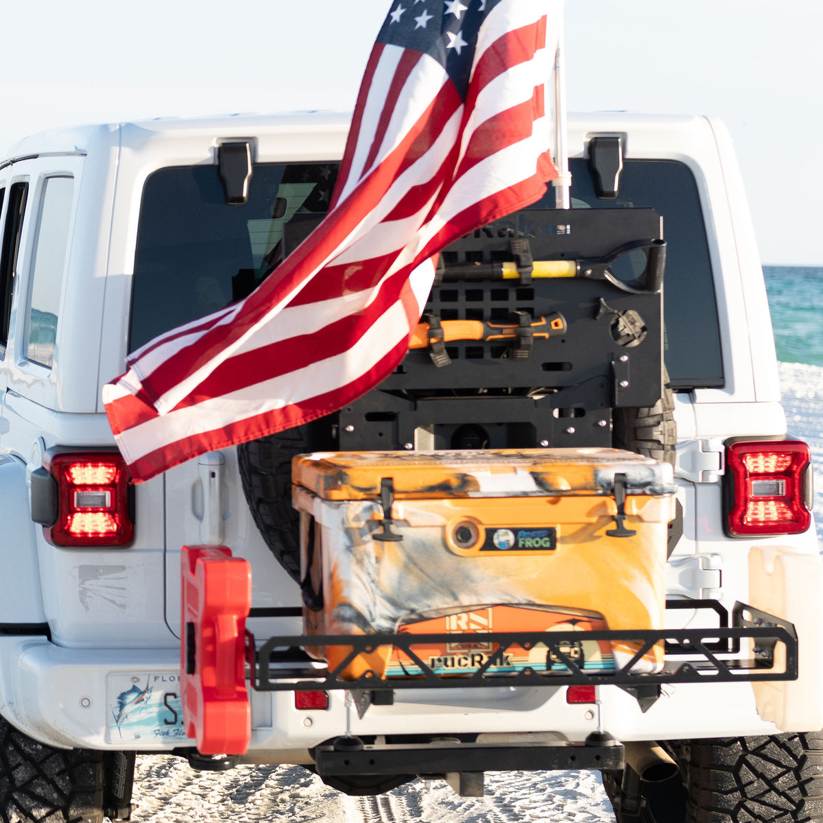 rucRak GRUNT swing-away cargo rack and bike carrier on a Jeep Wrangler JL spare tire