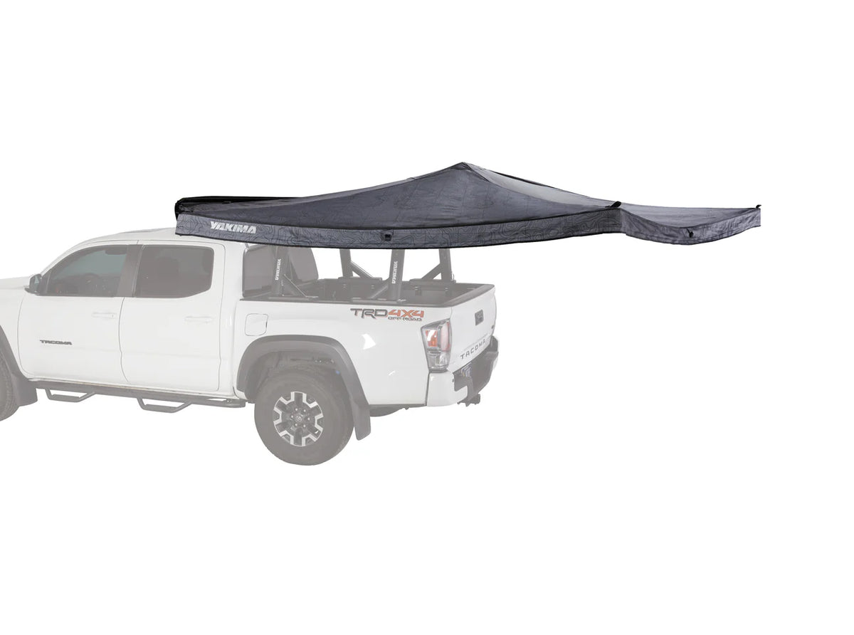 Yakima OverNOut 270-degree freestanding awning deployed beside a vehicle
